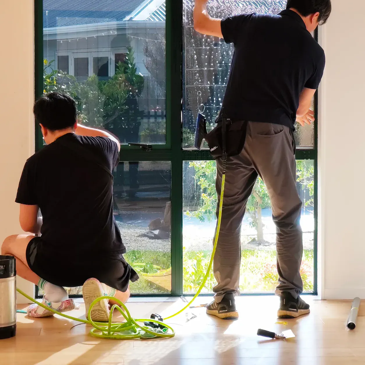 Zivent installers applying architectural film to a home slider