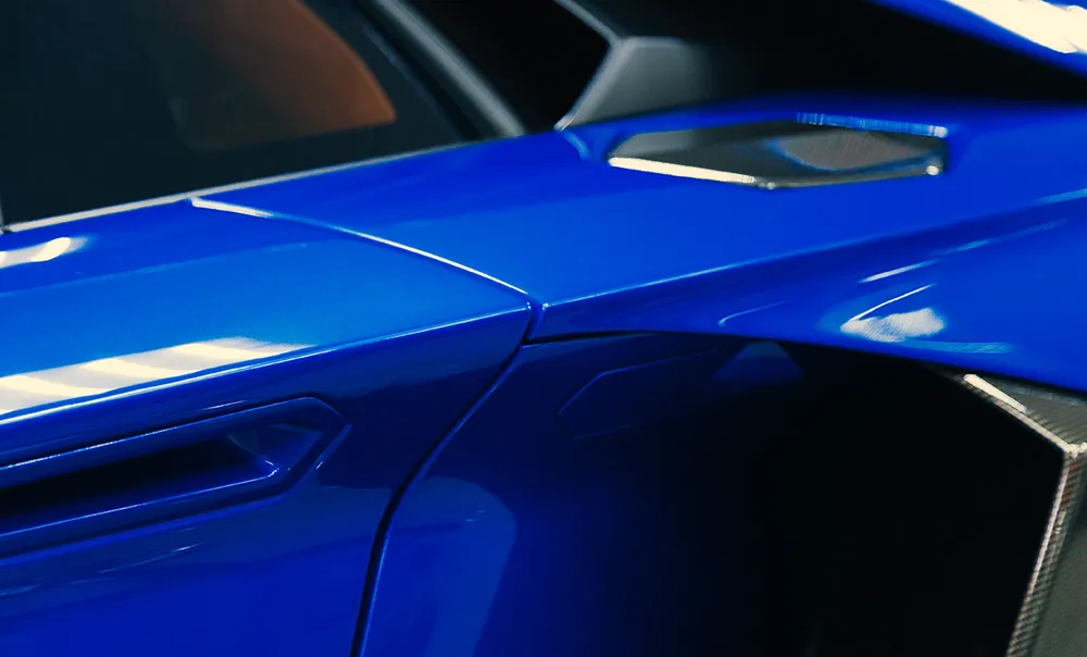 Deep blue vehicle panel finished in a colour-change wrap