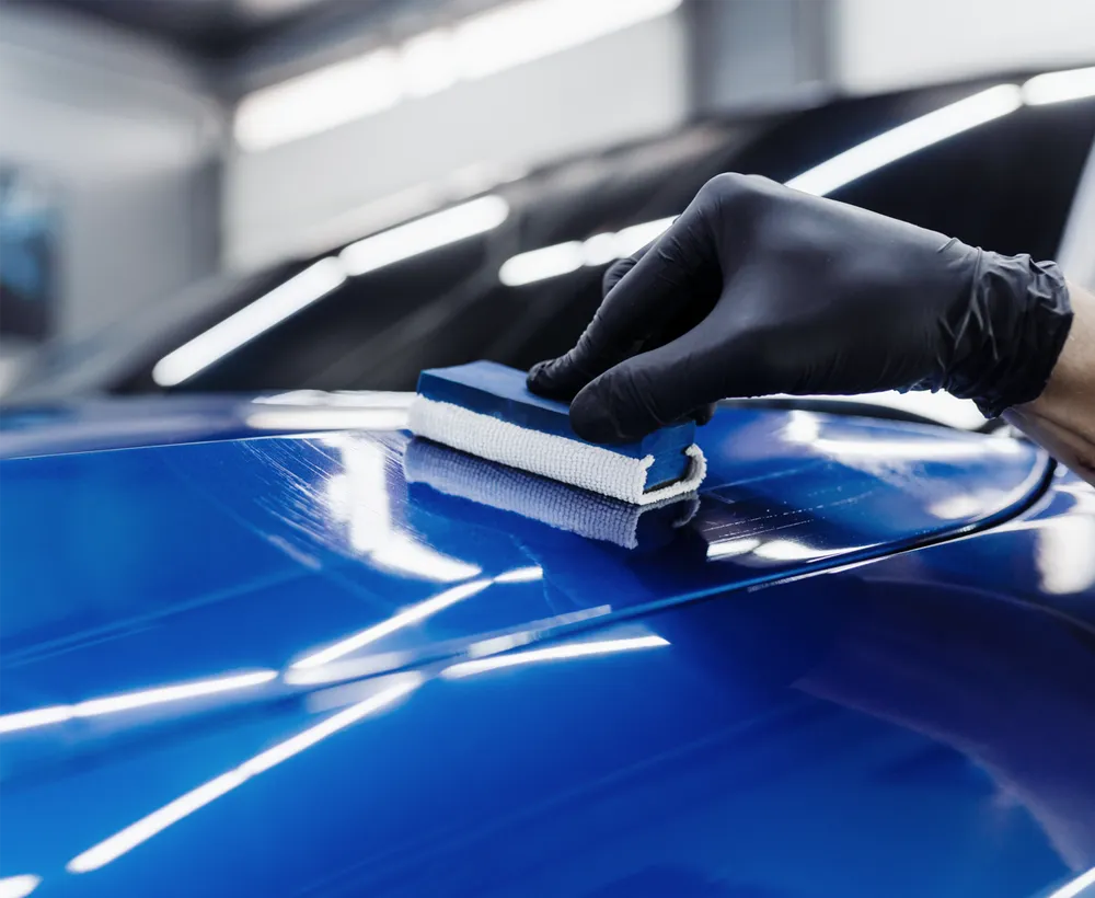 Zivent film being squeegeed onto a panel